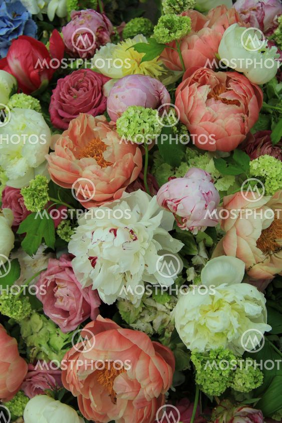 Peonies in a wedding arrangement