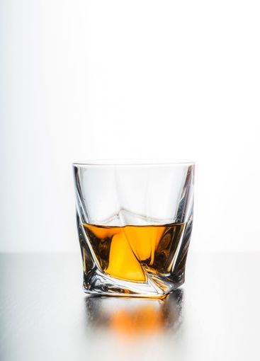 Strong alcoholic drink in glass close up