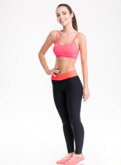 Full length portrait of a smiling sports woman