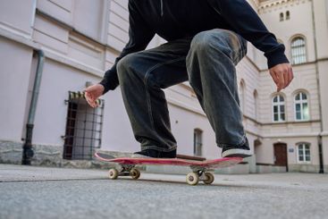 Skateboarder doing trick at urban street