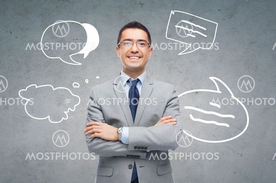 happy smiling businessman in eyeglasses and suit