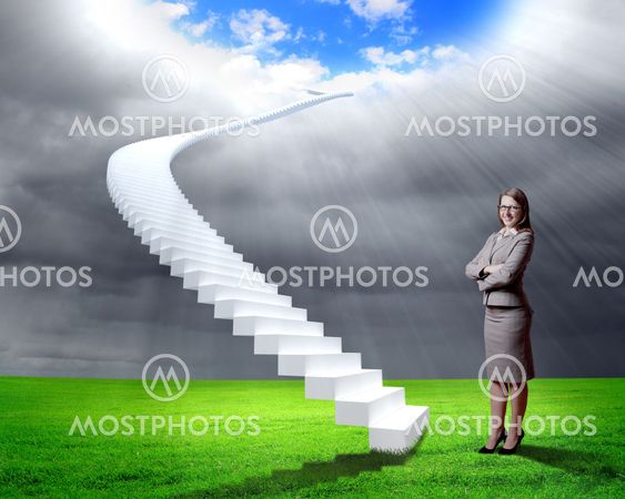 Businesswoman in suit standing near stairs
