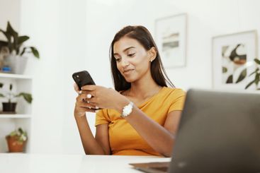 Remote work, texting and phone with woman in home office...