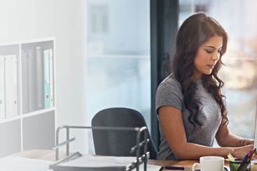 Computer, concentration and typing with designer woman...