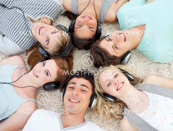 Group of teenagers listening to music