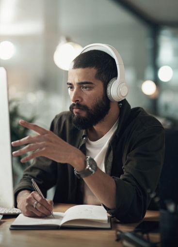 Creative, man and writing with notebook, idea and video...