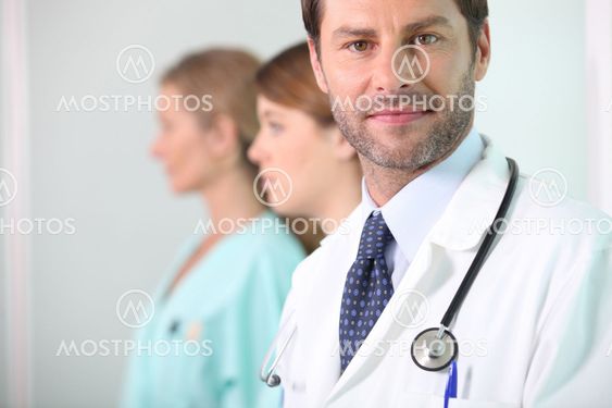 A medical doctor with his assistants