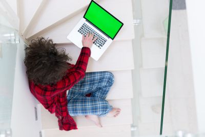 freelancer in bathrobe working from home