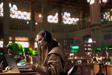 Young adult listening to study music and writing ideas...