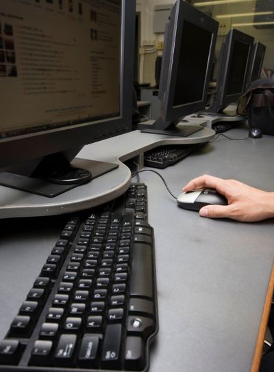 hand operating a mouse of computer 