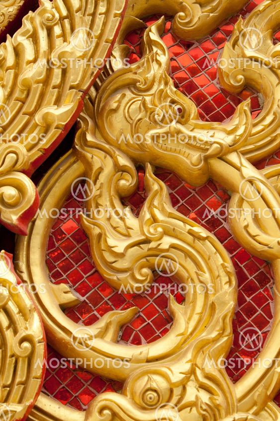 the gold stucco design of native thai style on the Wall