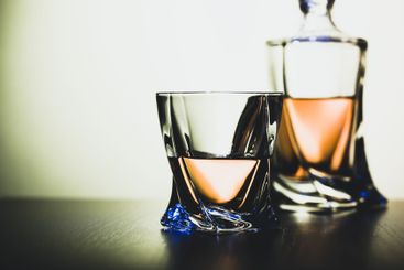 Strong alcoholic drink in glass close up