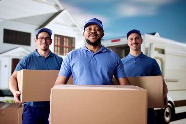 Professional Movers Unloading Boxes from Delivery Van