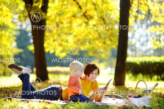 Beautiful middle aged woman and her adorable little...