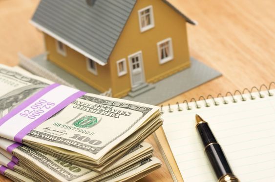 House and Money with Pad and Pen