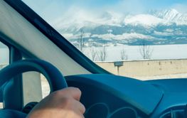 driving car by speedway winter season