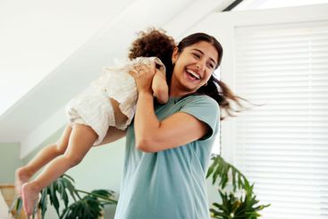 Home, smile and mother with baby, playing and bonding...
