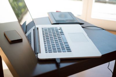 laptop, cellphone and graphic tablet