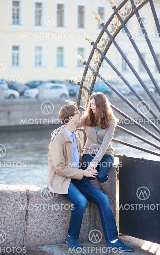 Dating couple close to the famous grill of the Summer garden in Saint-Petersburg, Russia