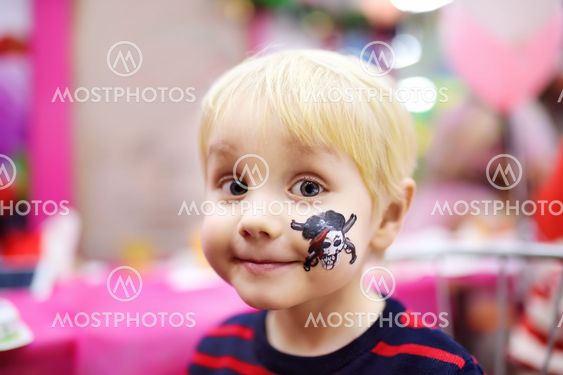 Face painting for cute little boy during kids birthday...