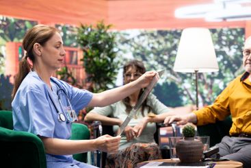 Medical caretaker presenting the x ray scan results and...