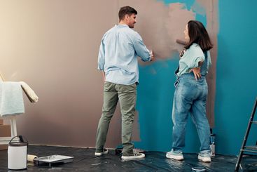 Diy, happy and couple painting in home for interior...