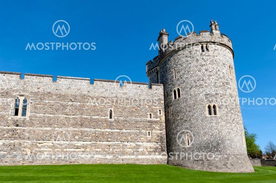 Windsor, UK - April 2018: The tower and wall near King Henry VIII Gate of Windsor Castle, royal residence at Windsor in county of Berkshire, England, UK