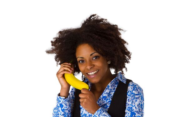 Female afro american with banana