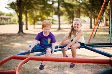 Fun, playground and youth with kids in park for growth,...
