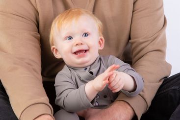 The face of a happy one year old baby