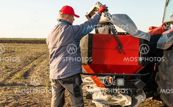 farmer preparing artificial fertilizers for work