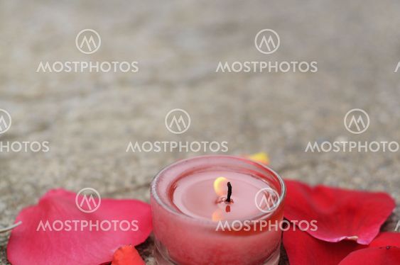 Candle with flower petals
