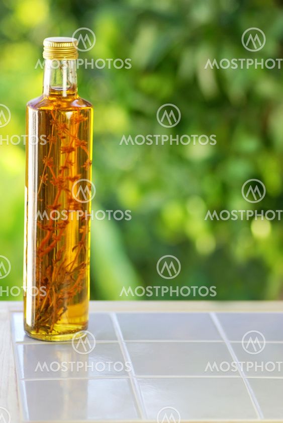 Bottle of vinegar on table.