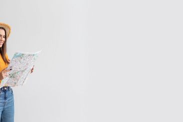 Happy travelers couple planning vacation and using...