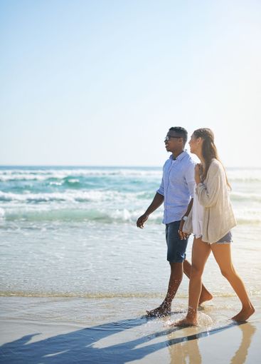 Seaside, walking and couple with love, vacation and...