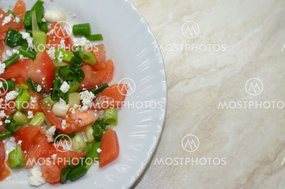Salad with tomatoes, cheese and onions