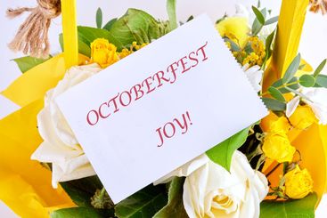 OCTOBERFEST JOY concept words on a white card in a...