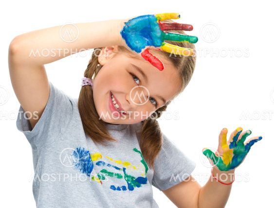 Portrait of a cute girl playing with paints