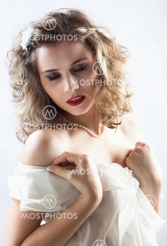 Young girl in white dress dancing