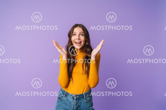 Image of young beautiful woman smiling and raising hands...