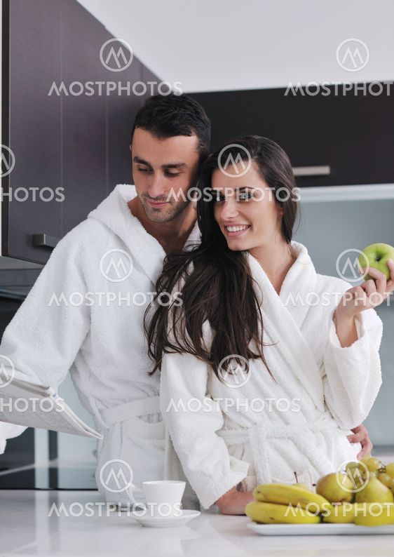 young couple have fun in modern kitchen