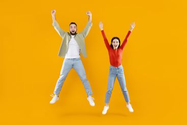 Happy couple celebrating together with joy and...