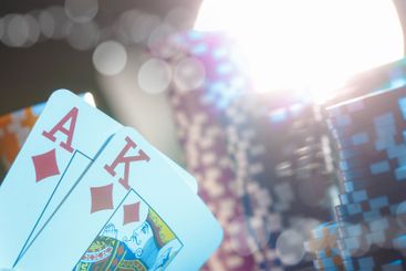 Poker game set of cards and chips close up