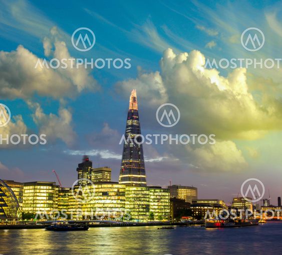 New London city hall at dusk, panoramic view from river.