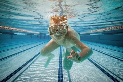 Boy swimming under water