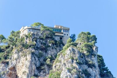 Daylight view to rock mountains with green trees and old...
