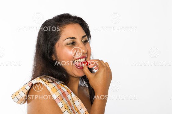 Indian Woman Eats Cherry Tomato