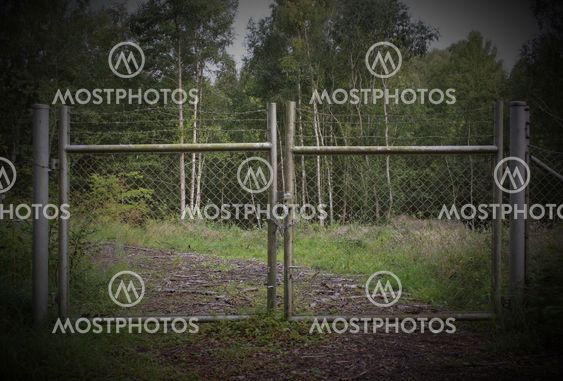 Old Door With Barbed Wire