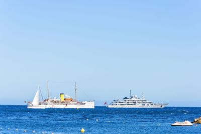 Daylight close-up view to white yacht and cruise ship...