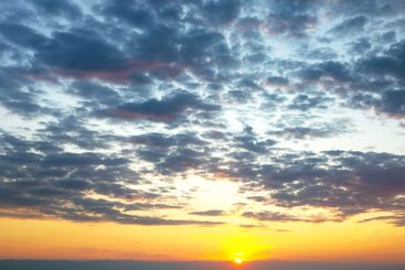 the expressive contrast of the clouds in the sky and...